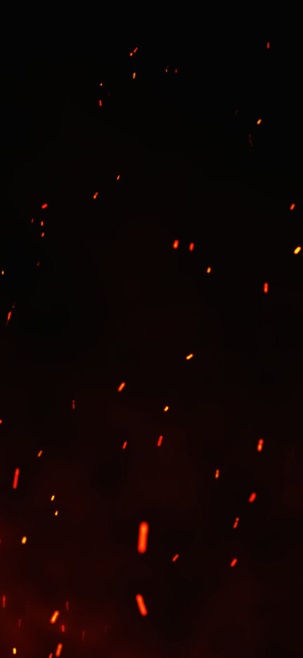 Ein schwarzer Hintergrund mit roten und orangefarbenen Flammen.